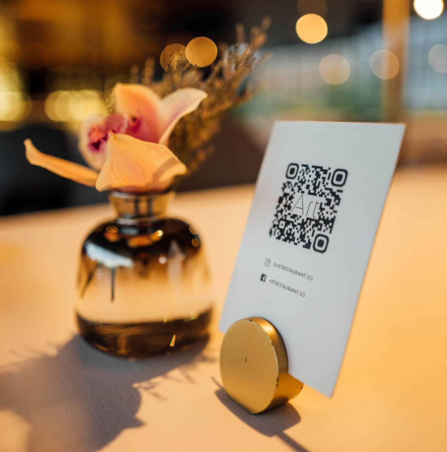 Business owner reviewing scan analytics from a trackable QR code campaign on printed marketing materials